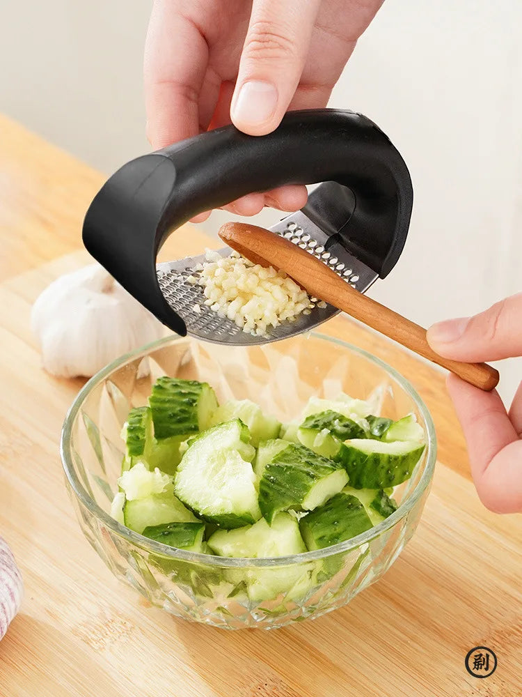 Stainless Steel Garlic Press: Effortless Crushing, Instant Flavor.