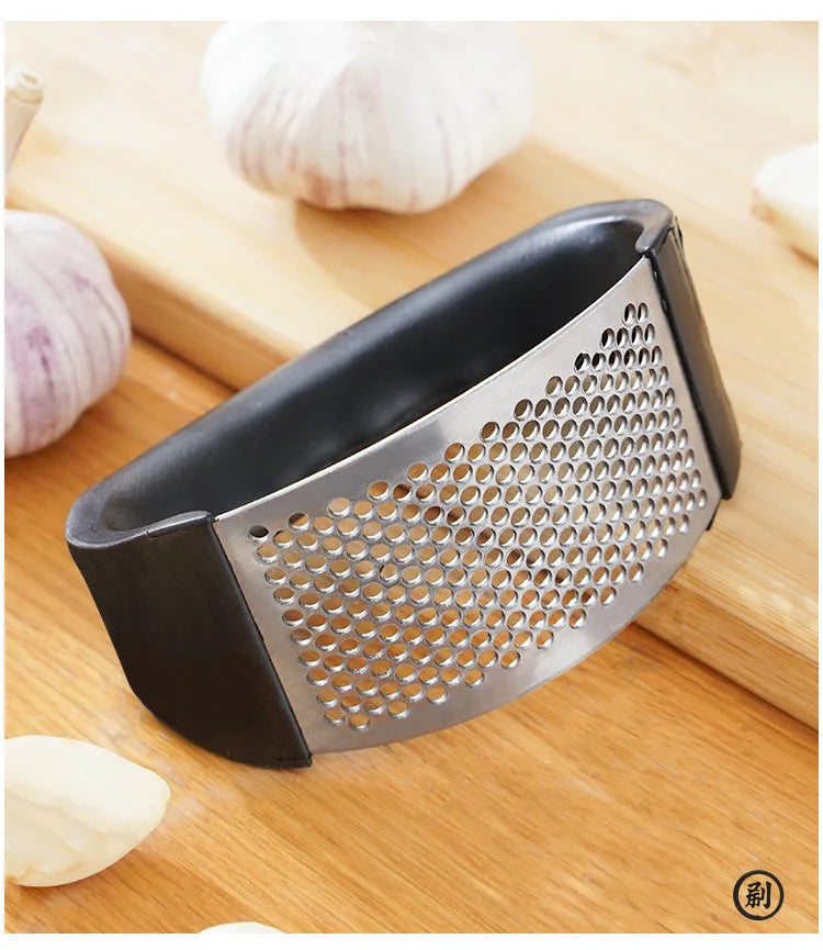 Stainless Steel Garlic Press: Effortless Crushing, Instant Flavor.