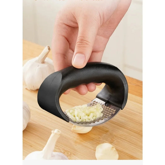 Stainless Steel Garlic Press: Effortless Crushing, Instant Flavor.
